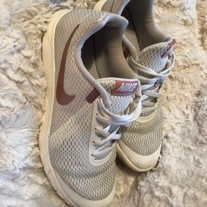 Rose gold nike running shoe